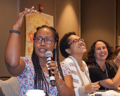 Shermaine Perry-Knights leading a Q&A at a conference